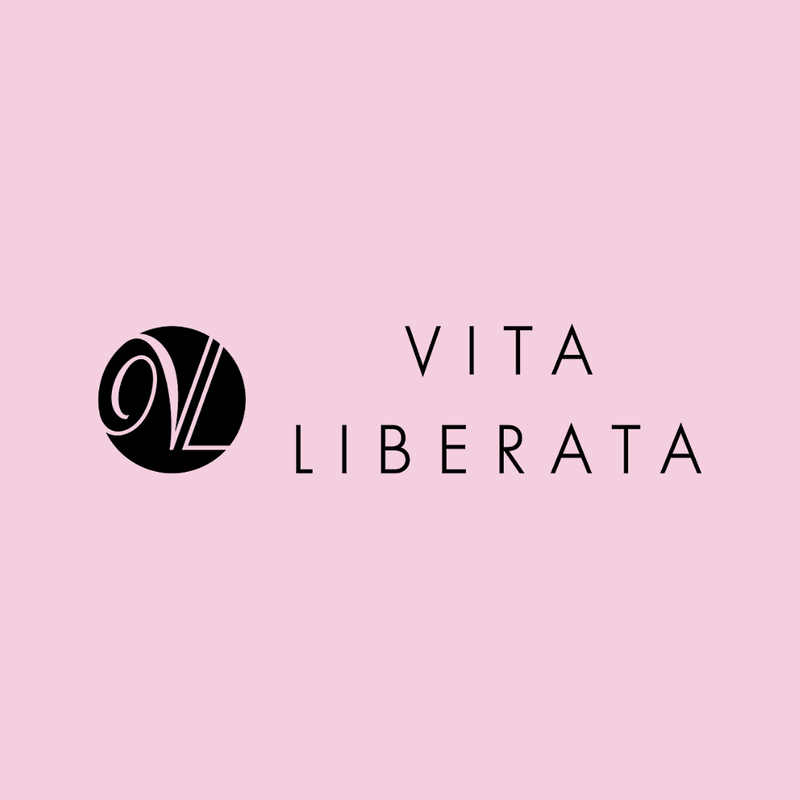 "Vita Liberata" Logo. Black on Baby Pink. Link to External Site. 